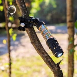 Fleximount wrapped around tree branch holding Silent Lantern with light on