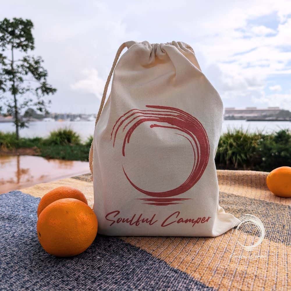 Soulful Camper canvas drawstring bag outdoor display with oranges